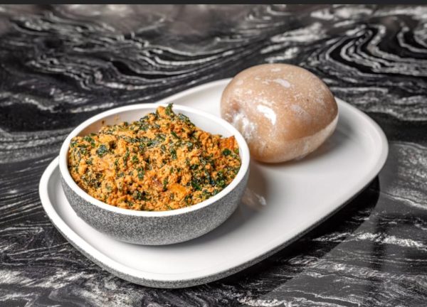 Eguisi soup with meat served with eba garri fufu